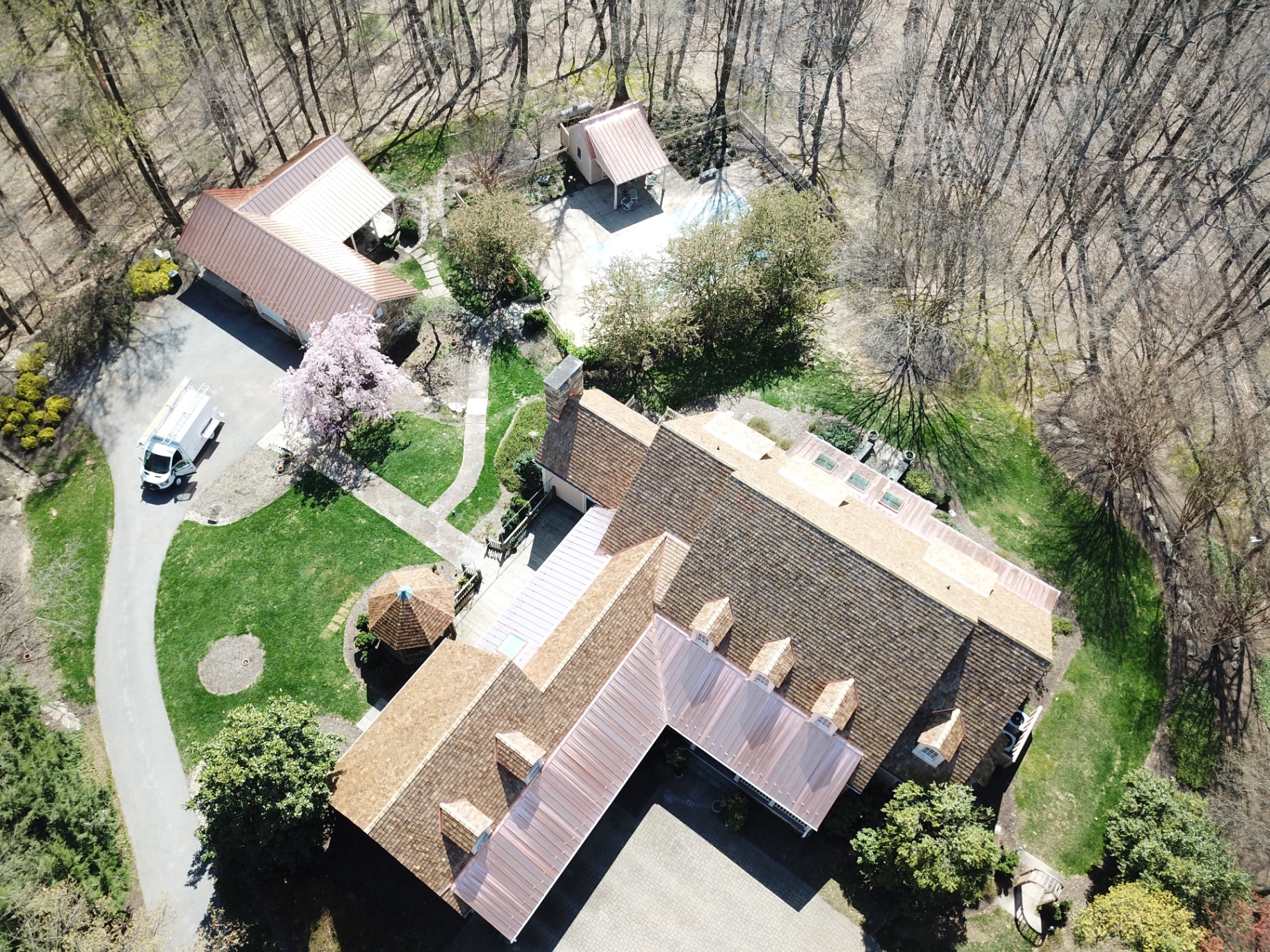 Aerial view of completed cedar shake and copper roof project