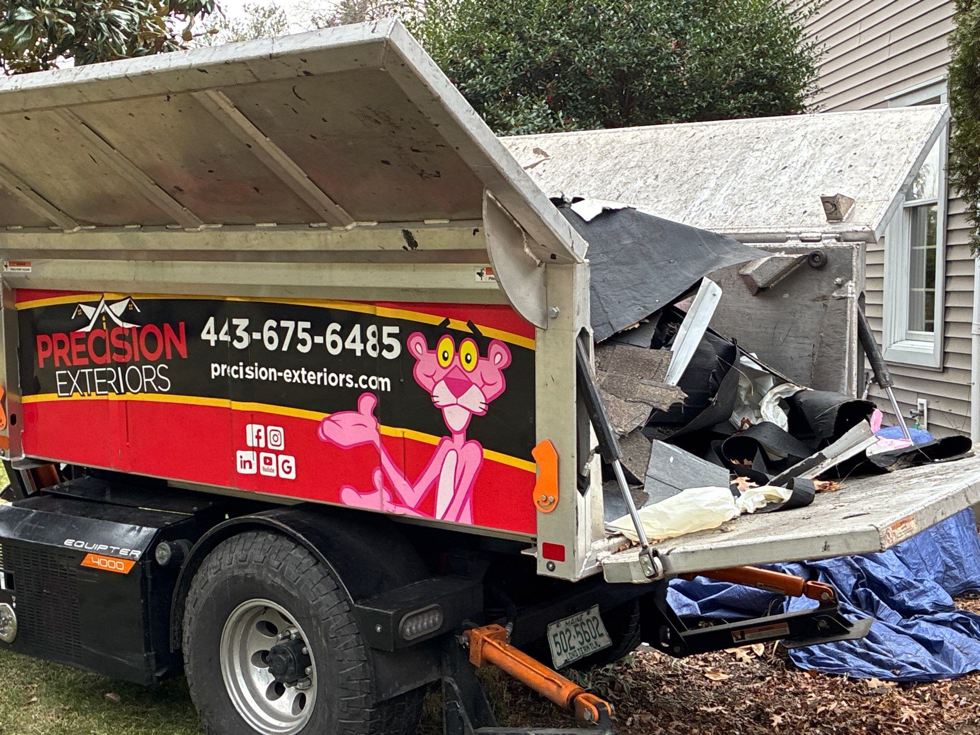 Precision Exteriors Equipter roof buggy on a job site