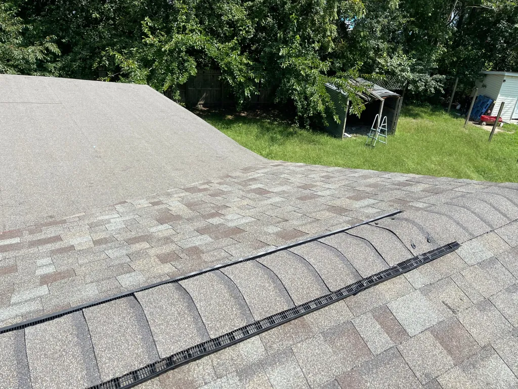 New architectural asphalt shingle roof with a continuous ridge vent on a home in Hurlock, Maryland