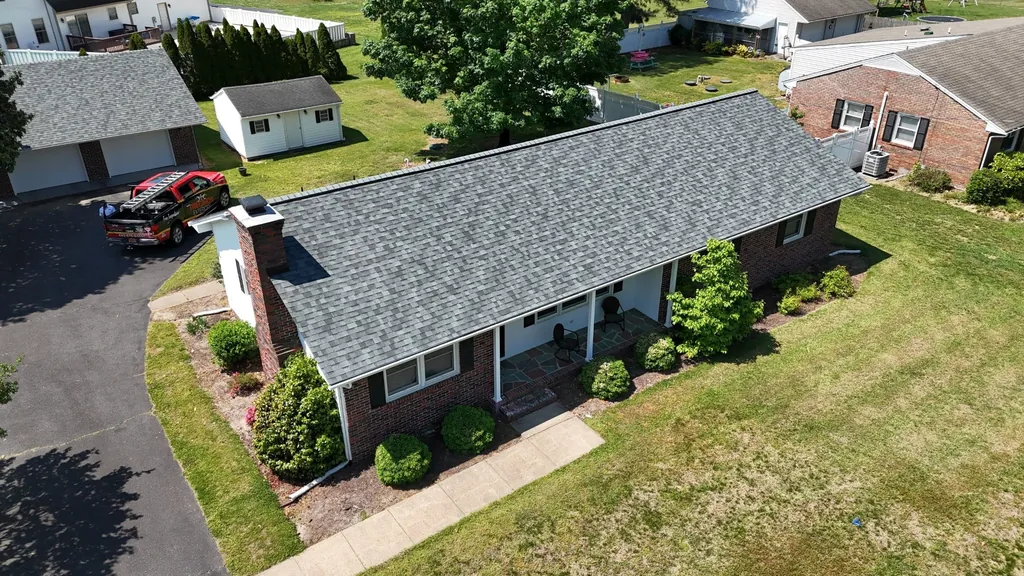 Cleaning debris from residential gutter