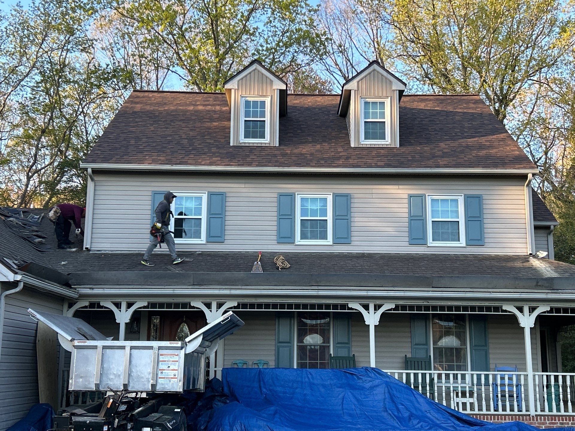 Precision Exteriors crew on a roofing project