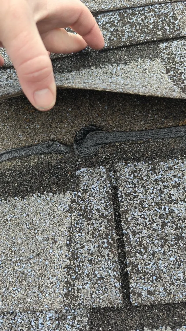 Cracked sealant at shingle junction found during roof inspection