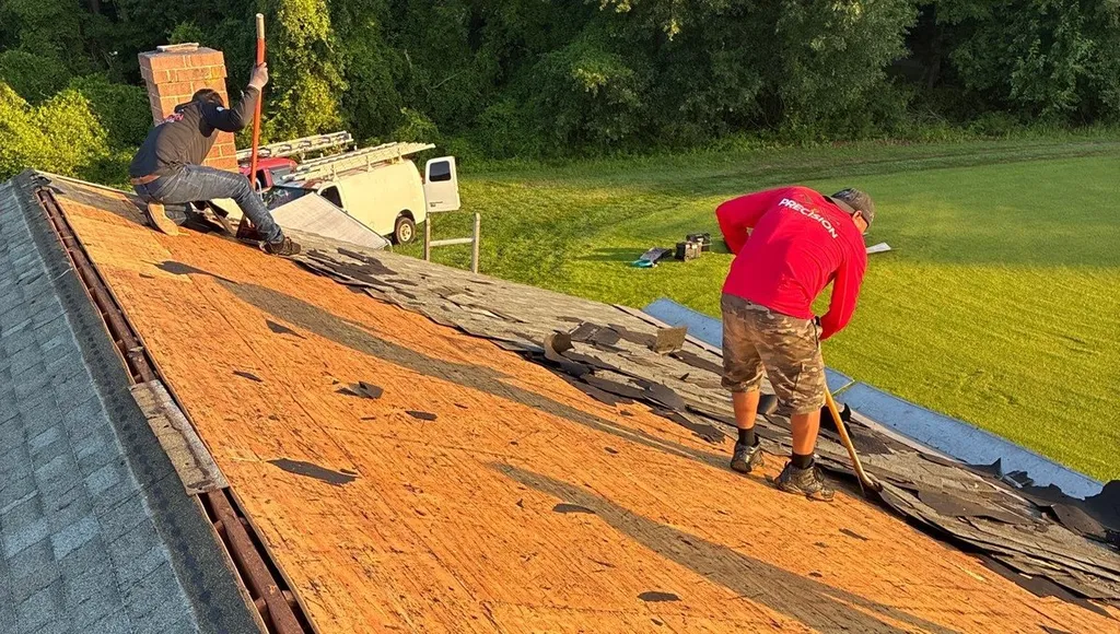 Precision Exteriors crew tearing off an old roof on a home in Easton, Maryland