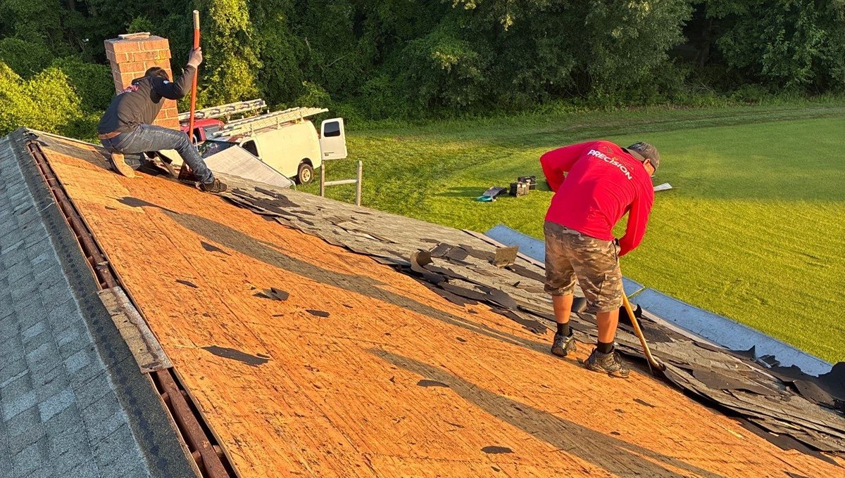 Precision Exteriors crew tearing off an old roof on a home in Easton, Maryland