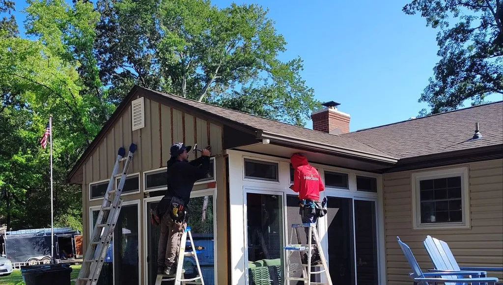 Precision Exteriors crew installing siding on a home in Salisbury, Maryland